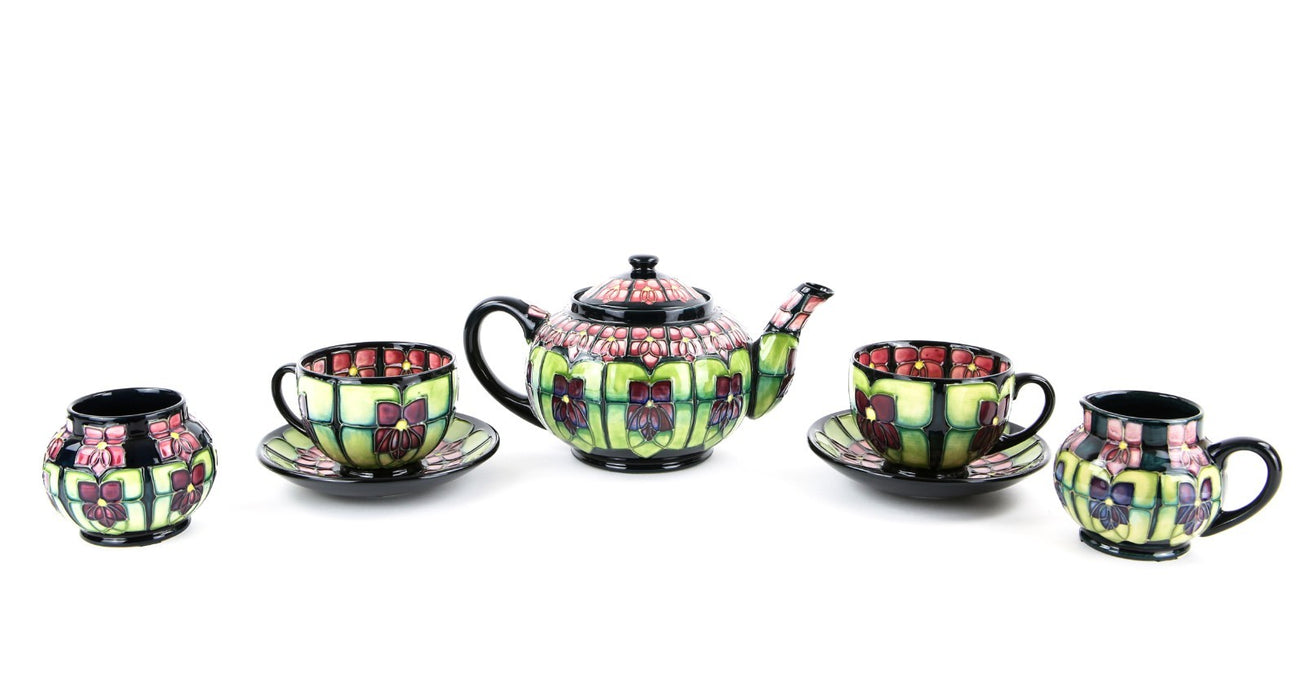 MOORCROFT POTTERY 'VIOLET' SALLY TUFFIN TETE-Á-TETE FLORAL TEA SET, BOXED