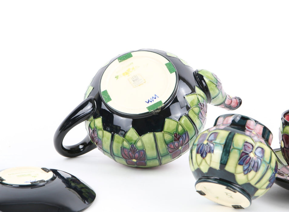 MOORCROFT POTTERY 'VIOLET' SALLY TUFFIN TETE-Á-TETE FLORAL TEA SET, BOXED