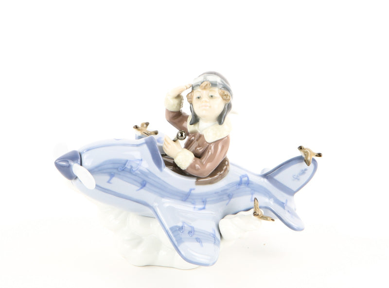 LLADRO 'OVER THE CLOUDS' BOY IN AEROPLANE FIGURE MODEL 5697, BOXED