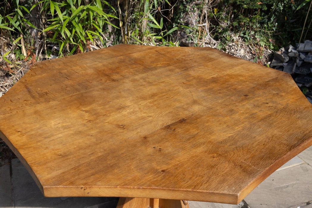 ROBERT 'MOUSEMAN' THOMPSON OF KILBURN - LARGE ADZED OAK OCTAGONAL DINING TABLE