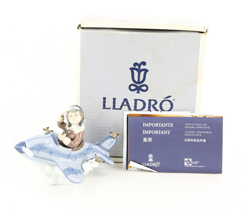 LLADRO 'OVER THE CLOUDS' BOY IN AEROPLANE FIGURE MODEL 5697, BOXED