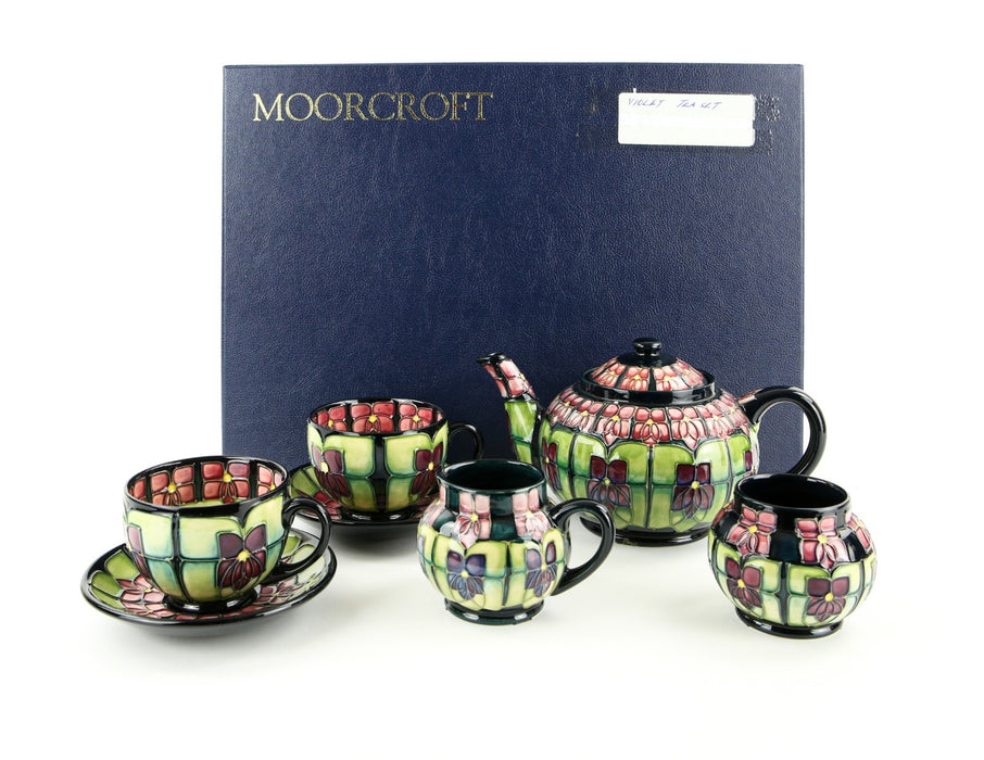 MOORCROFT POTTERY 'VIOLET' SALLY TUFFIN TETE-Á-TETE FLORAL TEA SET, BOXED