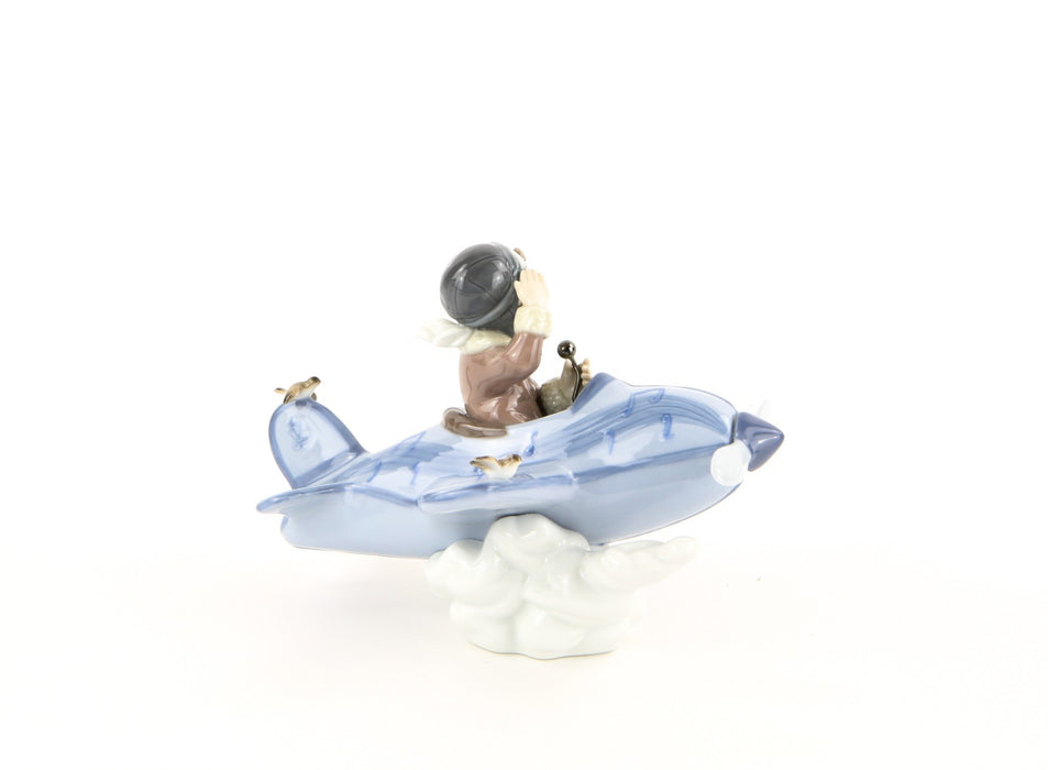 LLADRO 'OVER THE CLOUDS' BOY IN AEROPLANE FIGURE MODEL 5697, BOXED
