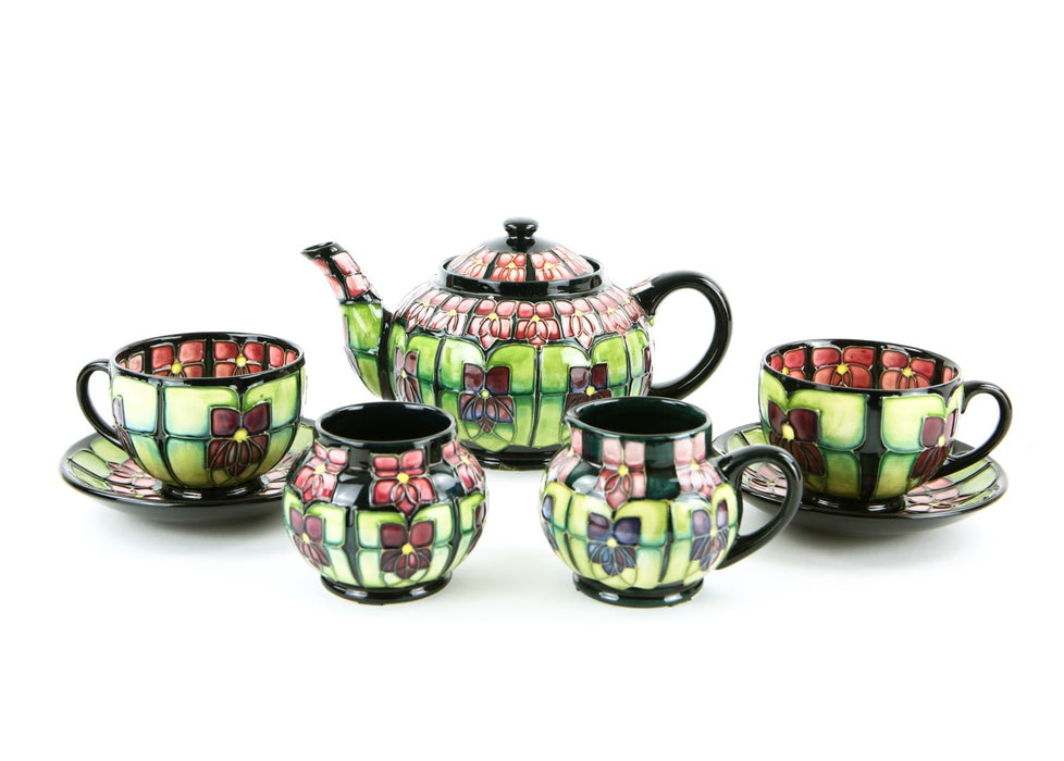 MOORCROFT POTTERY 'VIOLET' SALLY TUFFIN TETE-Á-TETE FLORAL TEA SET, BOXED