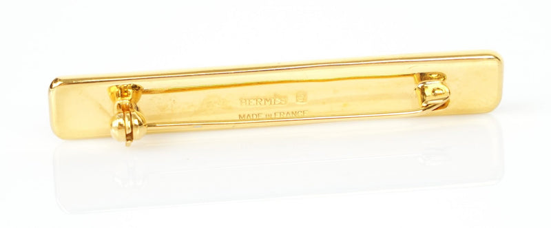 HERMES, PARIS - GILT &amp; ENAMEL BLUE SCARF BAR BROOCH